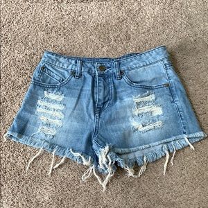 High waisted, distressed shorts.